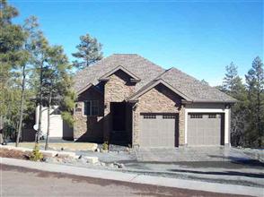 Beautiful new home in Sierra Pines and it is stunning from top to bottom! Magnificent views from every window. Living room and master bedroom have coffered ceilings that are amazing.  Show Low, Arizona 85901.